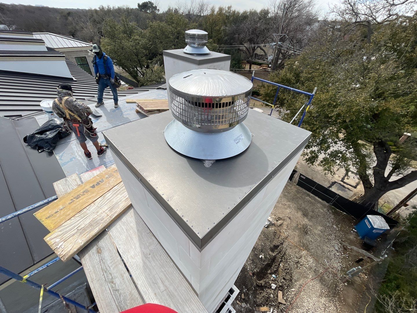 Crew finishing the chimney flashing