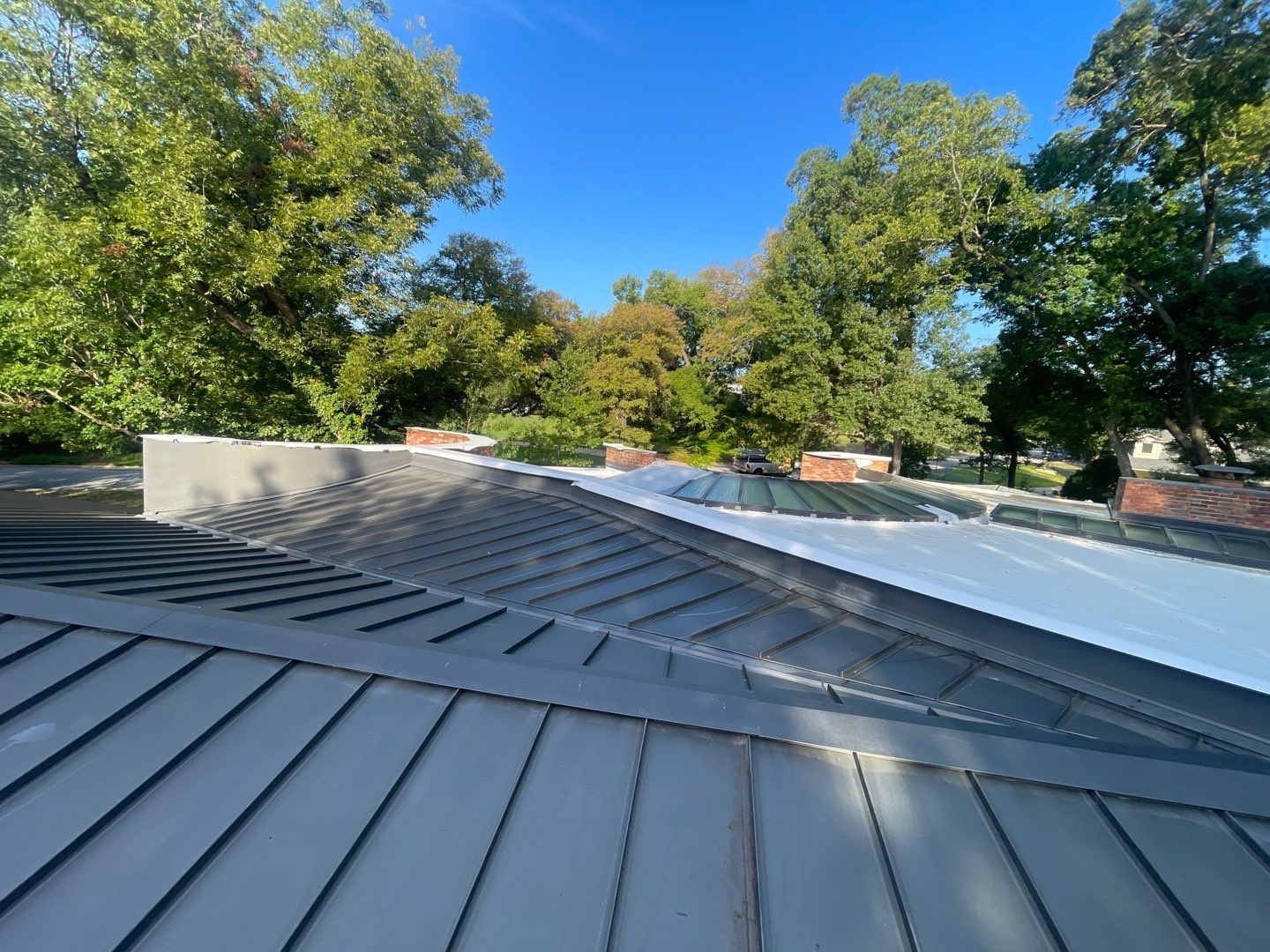Low-slope section beside the metal roof